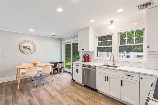 130 Sands Point Rd, Sands Point, NY 11050 - kitchen featuring stainless steel dishwasher, a sink, decorative backsplash, light stone countertops, and recessed lighting