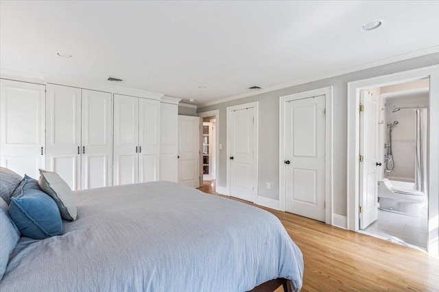 130 Sands Point Rd, Sands Point, NY 11050 - bedroom featuring multiple closets, crown molding, light wood finished floors, baseboards, and recessed lighting