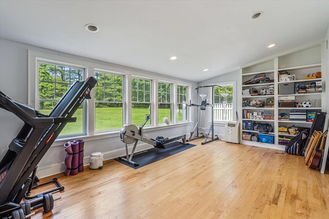 130 Sands Point Rd, Sands Point, NY 11050 - exercise area featuring wood finished floors, vaulted ceiling, healthy amount of natural light, and recessed lighting