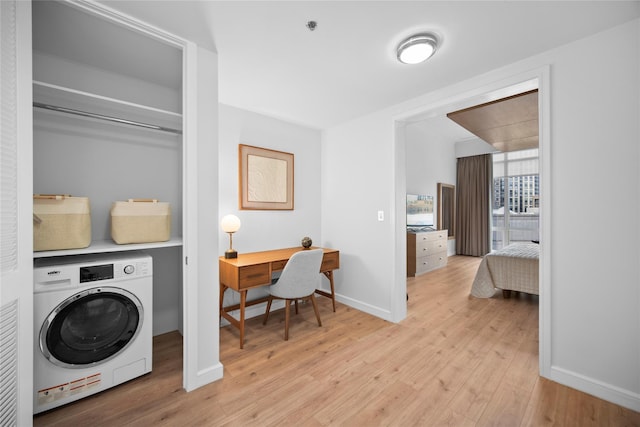 1 Renaissance Sq Unit 10B, White Plains, NY 10601 - laundry area with washer / clothes dryer, light wood-type flooring, baseboards, and an office area
