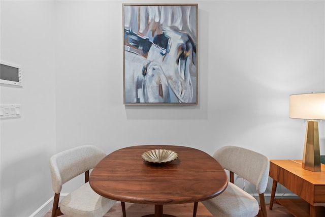 1 Renaissance Sq Unit 10B, White Plains, NY 10601 - dining room featuring baseboards and wood finished floors