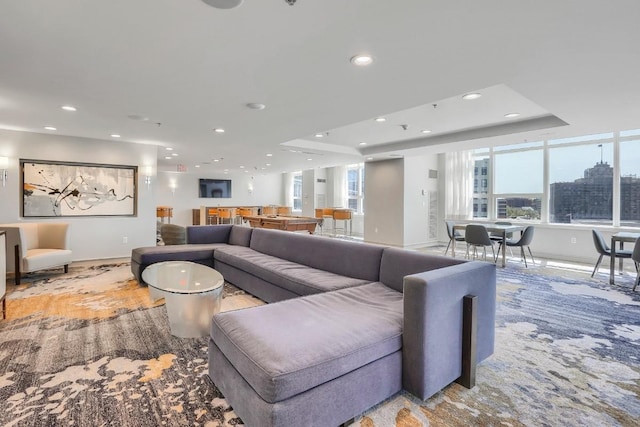 1 Renaissance Sq Unit 10B, White Plains, NY 10601 - living area featuring baseboards, recessed lighting, and a tray ceiling