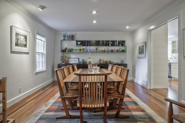 24 Cedar Ln, Sands Point, NY 11050 - dining room with wood finished floors, crown molding, baseboards, and recessed lighting