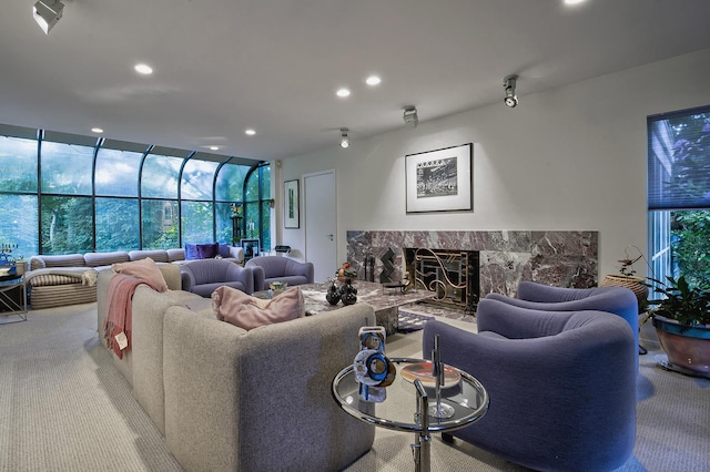 24 Cedar Ln, Sands Point, NY 11050 - carpeted living room with a high end fireplace, recessed lighting, and expansive windows