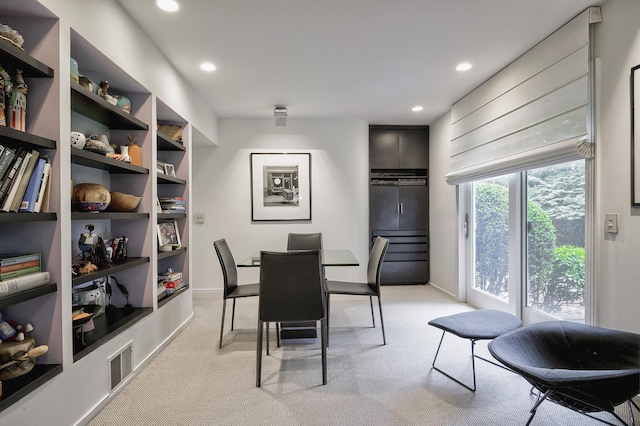 24 Cedar Ln, Sands Point, NY 11050 - dining space with light carpet, recessed lighting, baseboards, and built in features