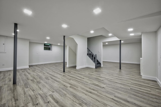 24 Cedar Ln, Sands Point, NY 11050 - finished basement featuring stairs, wood finished floors, recessed lighting, and baseboards
