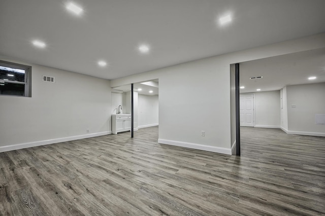 24 Cedar Ln, Sands Point, NY 11050 - finished below grade area with wood finished floors, recessed lighting, and baseboards