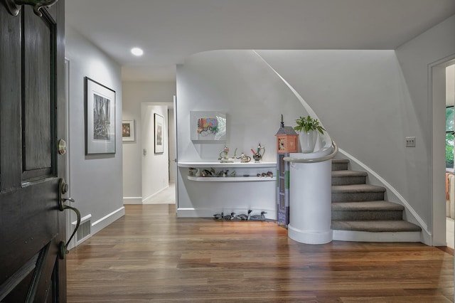 24 Cedar Ln, Sands Point, NY 11050 - foyer entrance featuring wood finished floors, stairway, recessed lighting, and baseboards