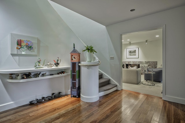 24 Cedar Ln, Sands Point, NY 11050 - living room featuring wood finished floors, stairs, baseboards, and recessed lighting