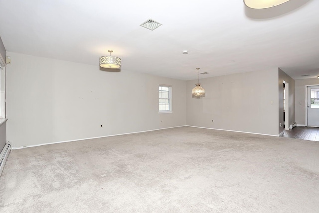 503 Jumano Ct, Suffern, NY 10901 - carpeted empty room featuring baseboards and a chandelier