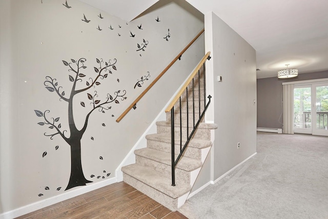 503 Jumano Ct, Suffern, NY 10901 - stairs featuring a baseboard heating unit, baseboards, and wood finished floors
