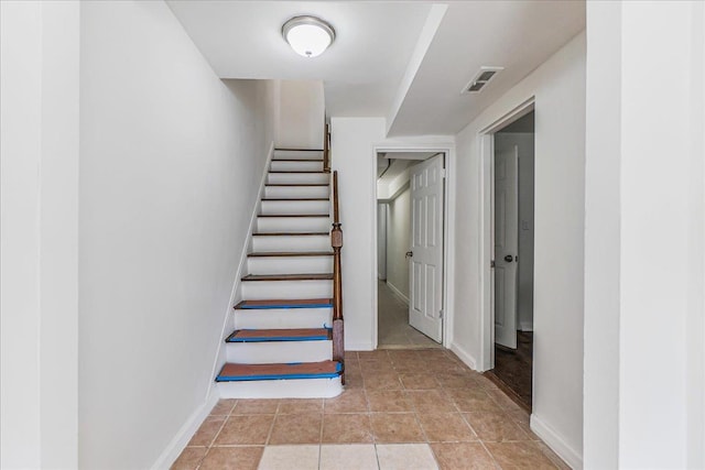 1049 E 219th St, Bronx, NY 10469 - stairway with baseboards and tile patterned floors