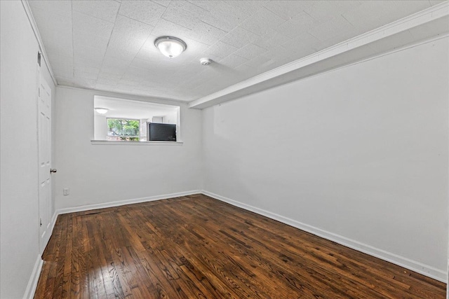 1049 E 219th St, Bronx, NY 10469 - spare room with dark wood-type flooring, baseboards, and a smoke detector