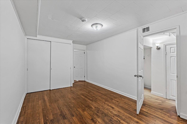 1049 E 219th St, Bronx, NY 10469 - below grade area with wood finished floors, crown molding, and baseboards