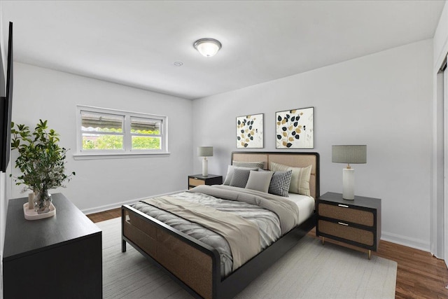 1049 E 219th St, Bronx, NY 10469 - bedroom featuring baseboards and wood finished floors