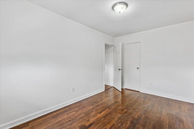 1049 E 219th St, Bronx, NY 10469 - unfurnished room with baseboards and wood finished floors