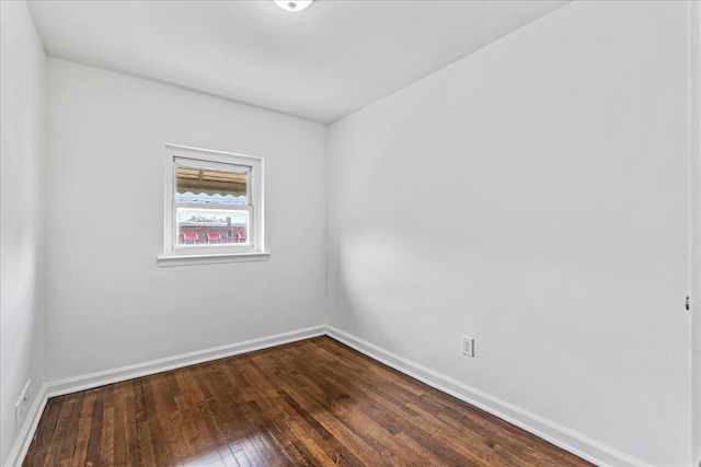 1049 E 219th St, Bronx, NY 10469 - empty room featuring dark wood-type flooring and baseboards