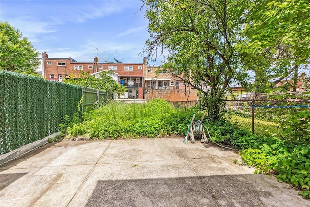1049 E 219th St, Bronx, NY 10469 - fenced backyard with a patio area