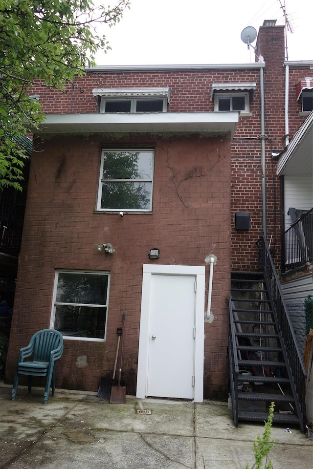 1049 E 219th St, Bronx, NY 10469 - rear view of house featuring brick siding