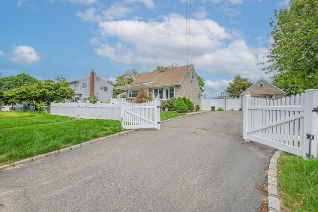 37 E Locust St, Central Islip, NY 11722 - view of property exterior with a gate