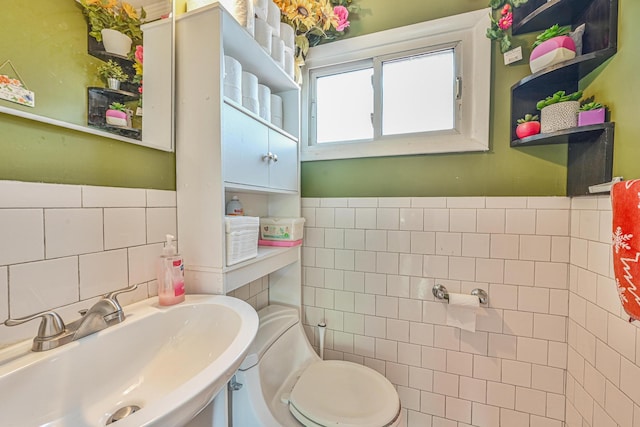 37 E Locust St, Central Islip, NY 11722 - half bathroom with a sink, tile walls, and toilet