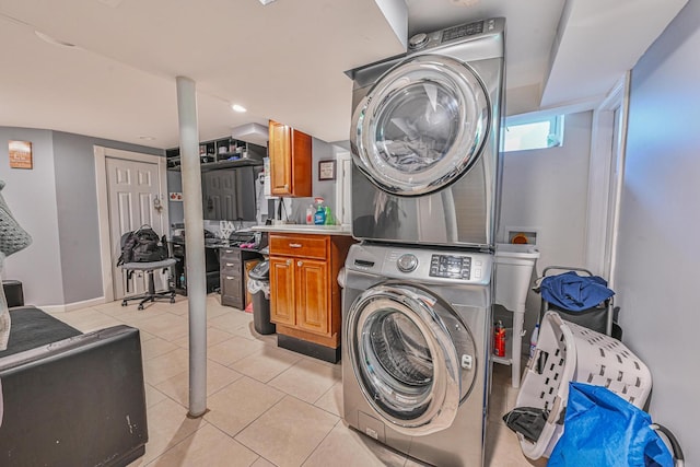 37 E Locust St, Central Islip, NY 11722 - laundry room featuring stacked washer / drying machine and light tile patterned flooring