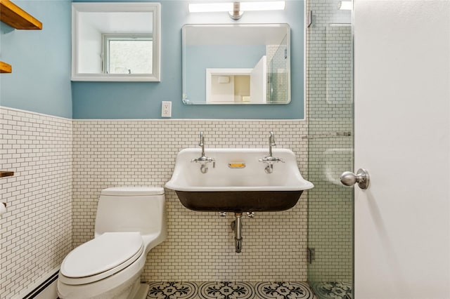931A Oceanfront St, Long Beach, NY 11561 - bathroom featuring tile walls, a baseboard radiator, and wainscoting