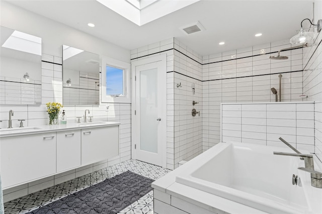 931A Oceanfront St, Long Beach, NY 11561 - full bathroom with double vanity, recessed lighting, and a skylight