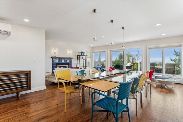 931A Oceanfront St, Long Beach, NY 11561 - dining area with wood finished floors, a wall mounted air conditioner, a fireplace, and recessed lighting