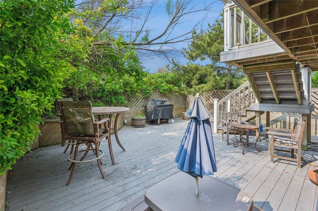 931A Oceanfront St, Long Beach, NY 11561 - wooden terrace with outdoor dining area, stairs, and a grill
