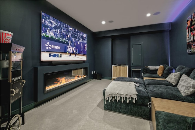 9 Wyndham Way, Port Washington, NY 11050 - home theater room featuring a glass covered fireplace, carpet, and recessed lighting