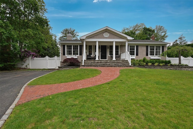 213 Glenwood Ln, Port Jefferson, NY 11777 - neoclassical / greek revival house featuring a chimney and covered porch