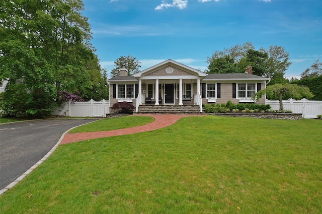 213 Glenwood Ln, Port Jefferson, NY 11777 - view of front of property featuring a chimney, covered porch, and asphalt driveway