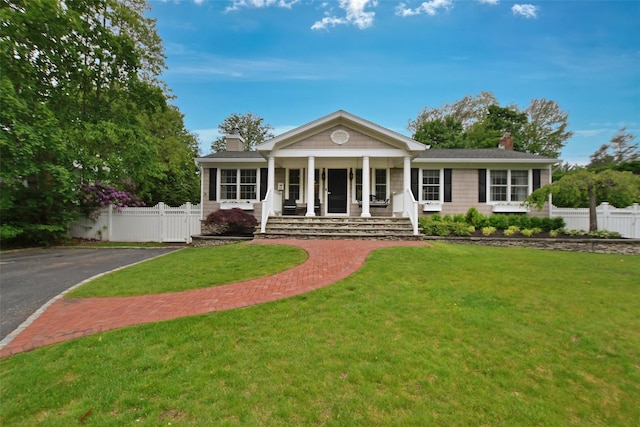 213 Glenwood Ln, Port Jefferson, NY 11777 - view of front facade featuring a chimney and covered porch