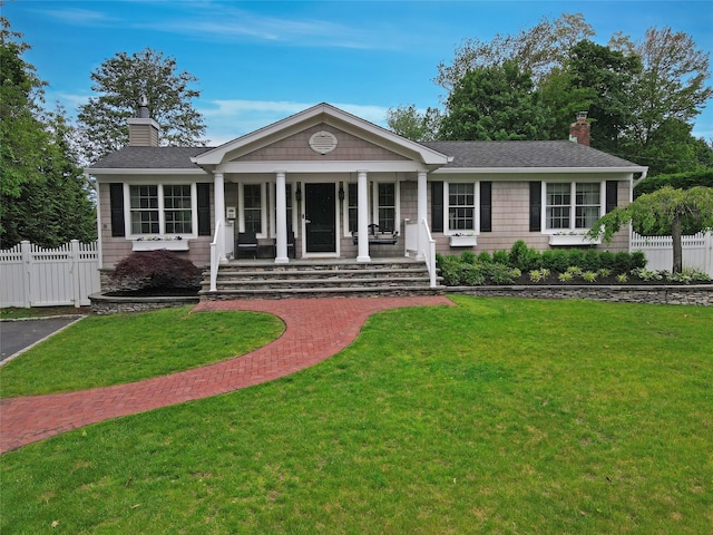 213 Glenwood Ln, Port Jefferson, NY 11777 - view of front of house featuring a chimney, a porch, and a shingled roof