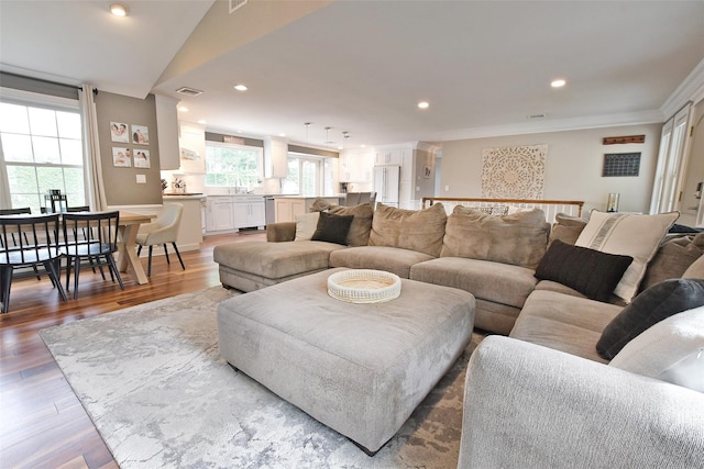 213 Glenwood Ln, Port Jefferson, NY 11777 - living area featuring wood finished floors, recessed lighting, and ornamental molding