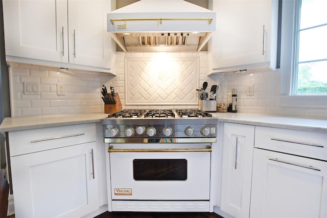 213 Glenwood Ln, Port Jefferson, NY 11777 - kitchen with high end white range, custom exhaust hood, white cabinets, and tasteful backsplash
