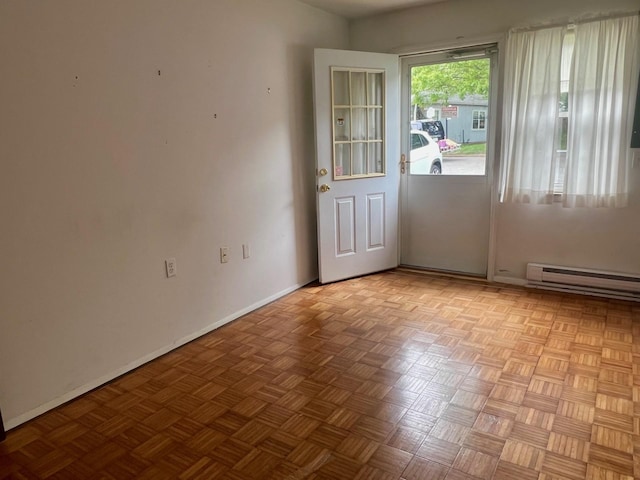 404B Woodbridge Dr Unit 404B, Ridge, NY 11961 - doorway featuring a baseboard heating unit and baseboards