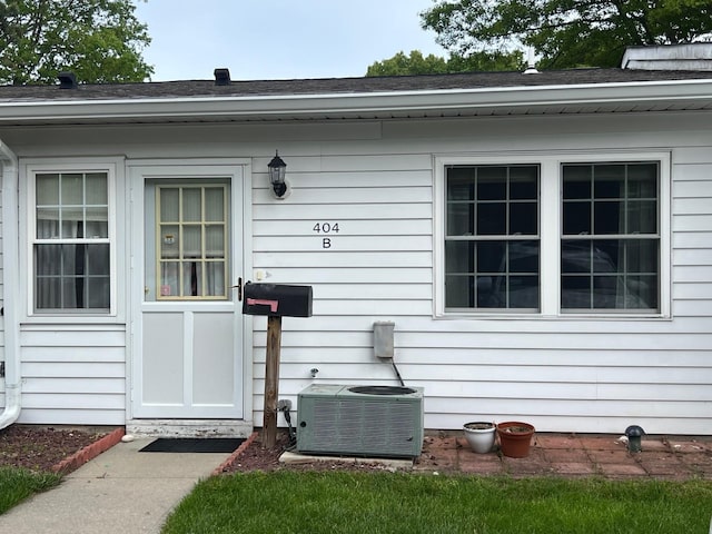 404B Woodbridge Dr Unit 404B, Ridge, NY 11961 - doorway to property featuring central air condition unit