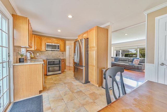 943 Durham Rd, East Meadow, NY 11554 - kitchen with appliances with stainless steel finishes, tasteful backsplash, a sink, light stone countertops, and ornamental molding