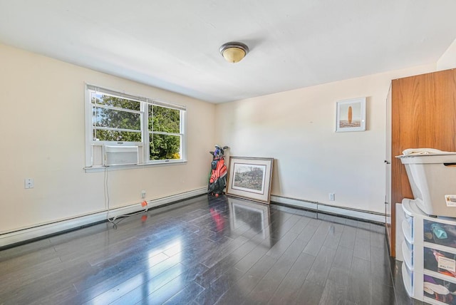 943 Durham Rd, East Meadow, NY 11554 - empty room featuring a baseboard heating unit, dark wood-style flooring, and baseboards