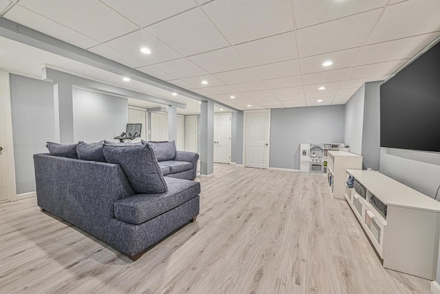 943 Durham Rd, East Meadow, NY 11554 - living area with light wood-style flooring, baseboards, recessed lighting, and a paneled ceiling