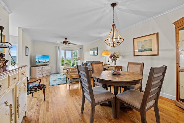 5005 John Hancock Ct Unit 100, New Windsor, NY 12553 - dining area with crown molding, light wood-style flooring, a chandelier, baseboards, and a ceiling fan
