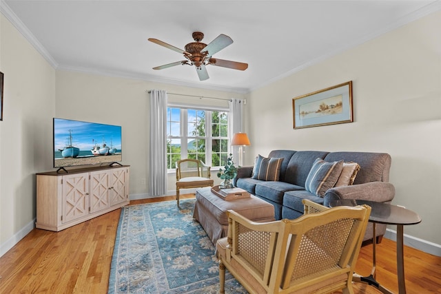 5005 John Hancock Ct Unit 100, New Windsor, NY 12553 - living area featuring crown molding, baseboards, wood finished floors, and ceiling fan