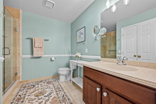 5005 John Hancock Ct Unit 100, New Windsor, NY 12553 - bathroom with toilet, vanity, a shower stall, and tile patterned floors