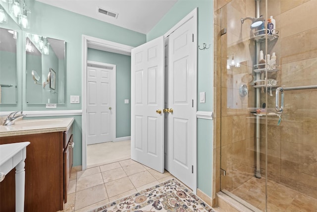5005 John Hancock Ct Unit 100, New Windsor, NY 12553 - full bath with vanity, a shower stall, tile patterned floors, and baseboards