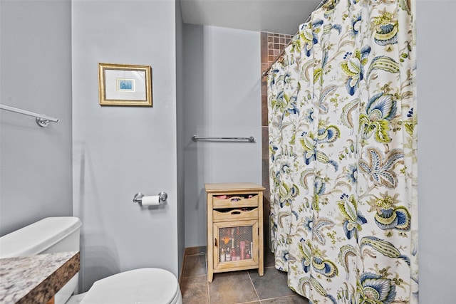 5005 John Hancock Ct Unit 100, New Windsor, NY 12553 - bathroom with toilet, curtained shower, and tile patterned flooring