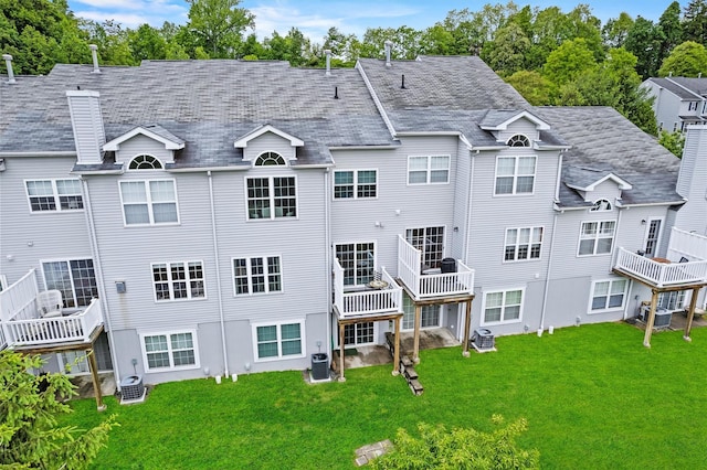 5005 John Hancock Ct Unit 100, New Windsor, NY 12553 - back of house featuring cooling unit, a lawn, and a chimney