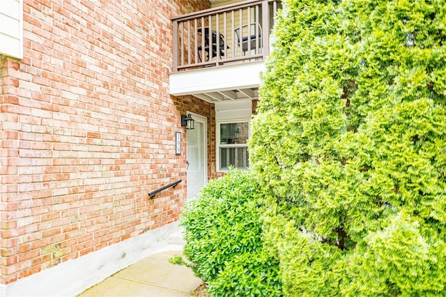 199 Millard Ave Unit 199, West Babylon, NY 11704 - property entrance with a balcony and brick siding