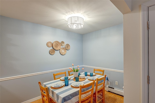 199 Millard Ave Unit 199, West Babylon, NY 11704 - dining room with a baseboard radiator, light wood finished floors, and baseboards